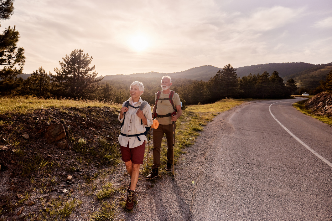 Senior couple hiking along a path